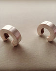 Chunky silver hoop earrings.