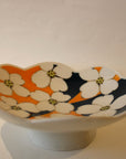 White Porcelain Bowl With Orange And Cobalt Blue Insides With White Flowers