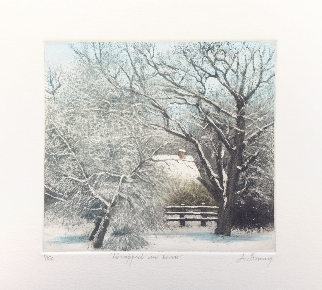 Hand colored etching of a wintery snowy scene with a house peaking out in the background.
